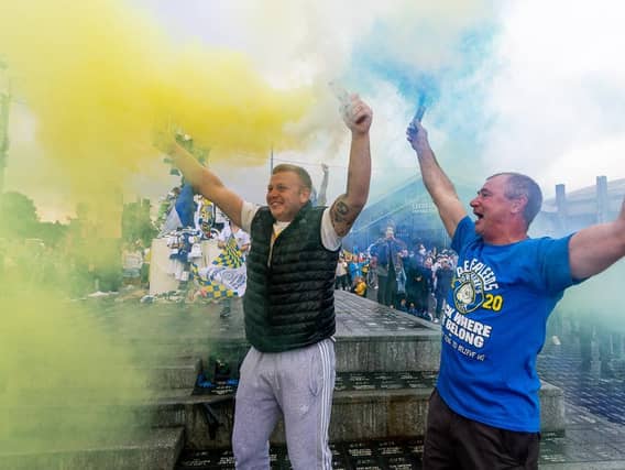 The party starts again. Leeds United fans celebrating outside Elland Road.