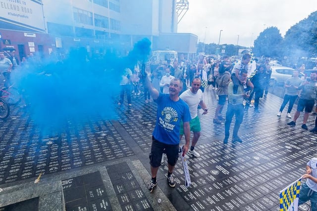 White, blue and yellow flares were lit outside the stadium as fans celebrated.
