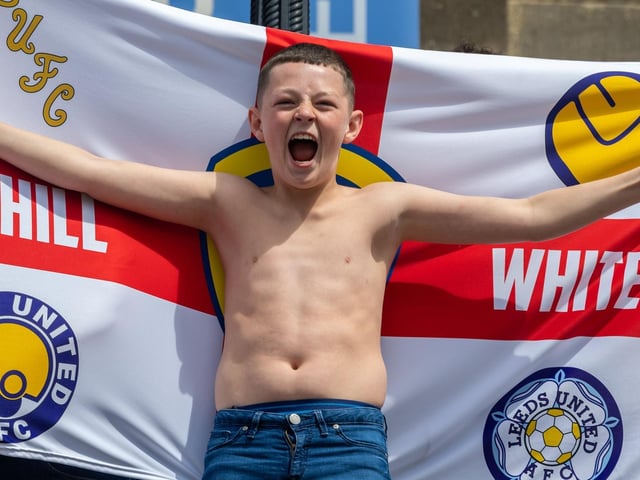 Leeds United fans celebrate at Millennium Square.