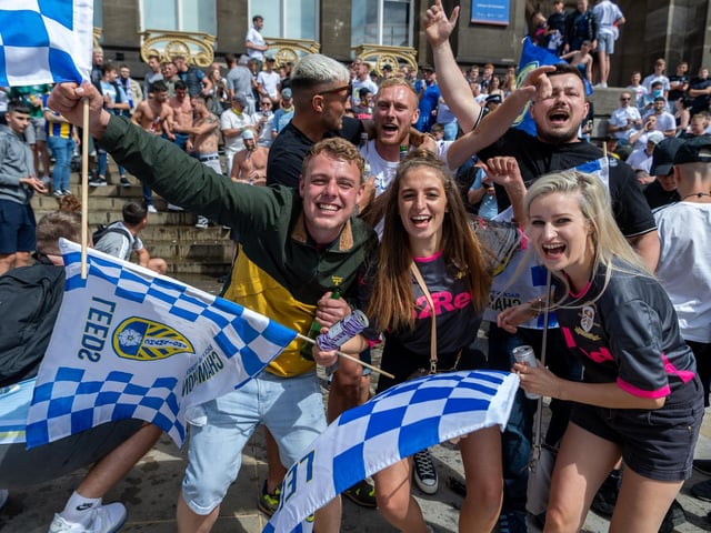 Leeds United fans celebrate at Millennium Square.