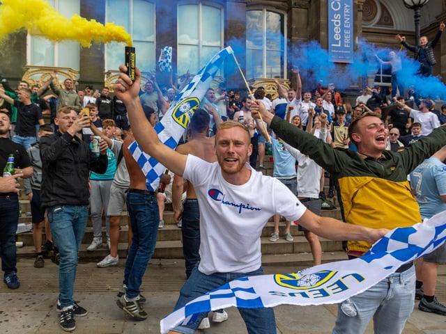 Leeds United fans celebrate at Millennium Square.