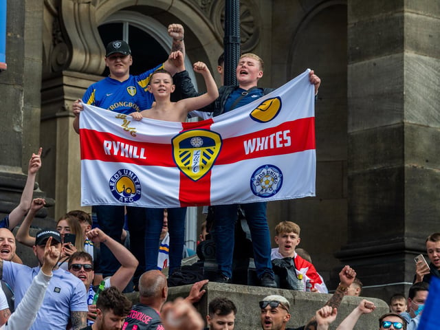 Leeds United fans celebrate at Millennium Square.