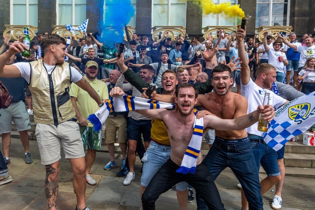 Leeds United fans celebrate at Millennium Square.