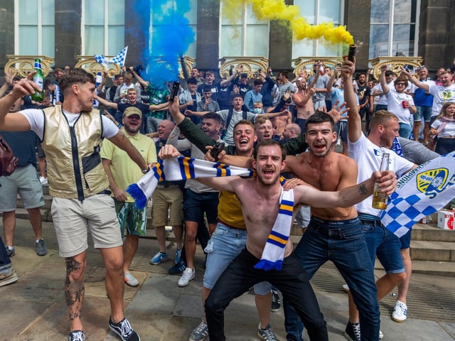Leeds United fans celebrate at Millennium Square.