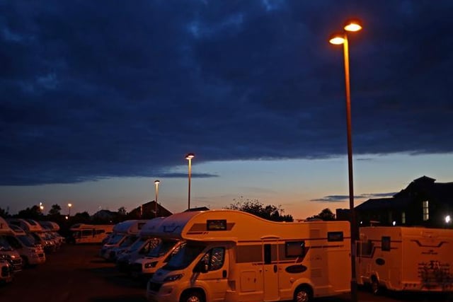Motorhomes are seen in the car park, being used to temporarily house medical staff working at the Royal Blackburn Teaching Hospital car park in Blackburn