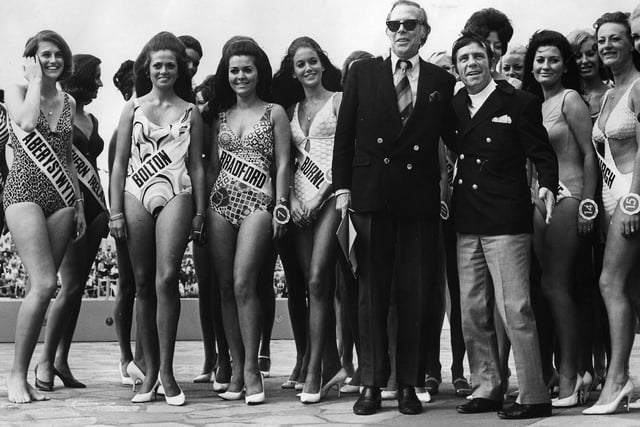 Dick Haymes and Norman Wisdom with some of the 43 finalists in the first round of the Miss United Kingdom Bathing Beauty Competition at the Open Air Baths, South Shore, Blackpool