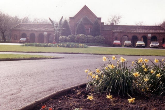 Circa 1980s. Cottingley Hall Cemetery and Crematorium on Churwell Ring Road. To the left of centre is the statue 'Winged Victory' which was originally part of the Leeds City War Memorial in Victoria Gardens.