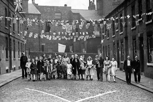 Woodhouse's Leicester Mount is lavishly decorated to welcome returning servicemen in 1945. This photo was taken from the vicinity of Leicester Terrace.