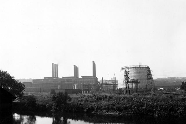 The construction of a cooling tower at Kirkstall Power Station in August 1945. The River Aire is in the foreground and Gotts Park is visible in the background.
