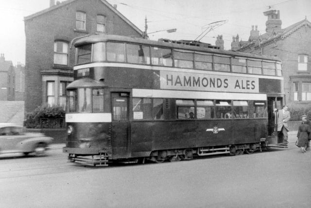 September 1954, View showing Tram no 509 on Dewsbury Road travelling on route no 9. Advert for 'Hammonds Ales' can be seen on side of tram.