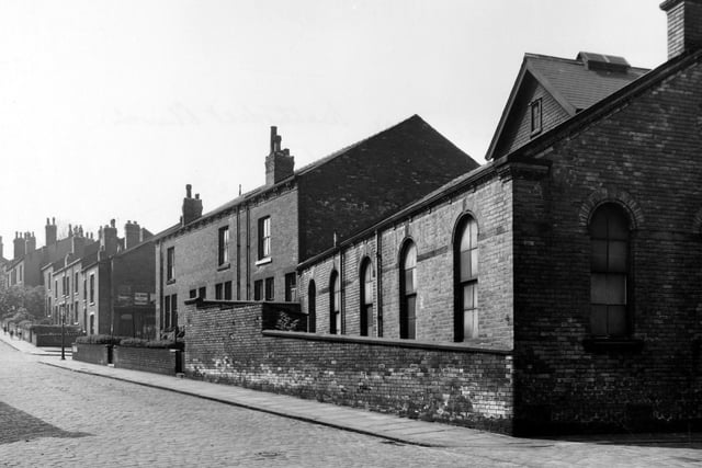 A view looking along Springfield Place showing the back of Woodhouse Hill Methodist Chapel in June 1955. This fronted on to Woodhouse Hill Road.