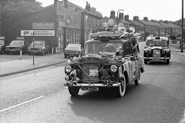 Annual disabled childrens taxi run from Manchester to Blackpool, on Leyland Road, Penwortham. Photographed by Terry Martin. Image courtesy of Nicola Martin of the Preston Past and Present Facebook group