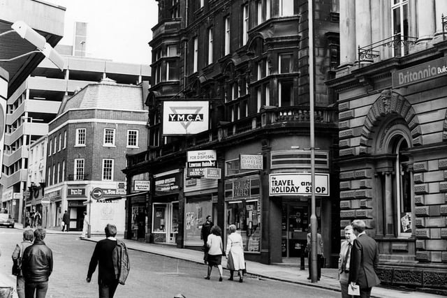 Shops on Albion Street in June 1984. From right, Britannia Building Society, then YMCA building with shops including Hunting Lambert travel agents, Raymond Appleson opticians and Bentley films photographic equipment.