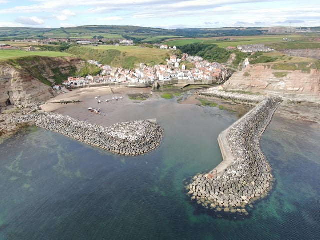 Looking into Staithes Harbour, and beyond, the site of ICL Potash at Boulby