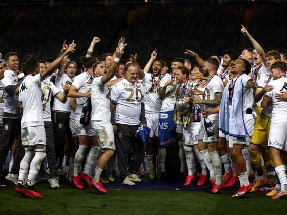 Leeds United's players celebrate with head coach Marcelo Bielsa.
