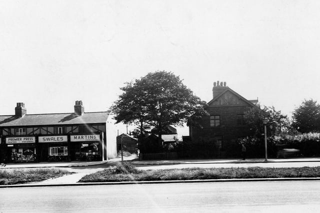 The east side of Station Road in July 1945, showing shops Martins Dyers And Cleaners Ltd, L.W. Swales, tripe dealers and Premier Press, printers.