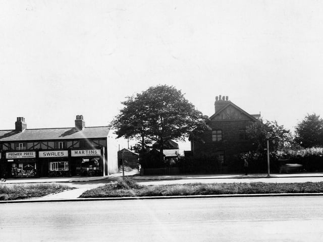 The east side of Station Road in July 1945, showing shops Martins Dyers And Cleaners Ltd, L.W. Swales, tripe dealers and Premier Press, printers.