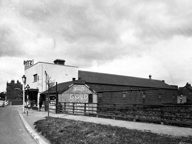 The east side of Station Road showing Bevins and Morris confectioners, the Ritz cinema and the Station Hotel in September 1945.