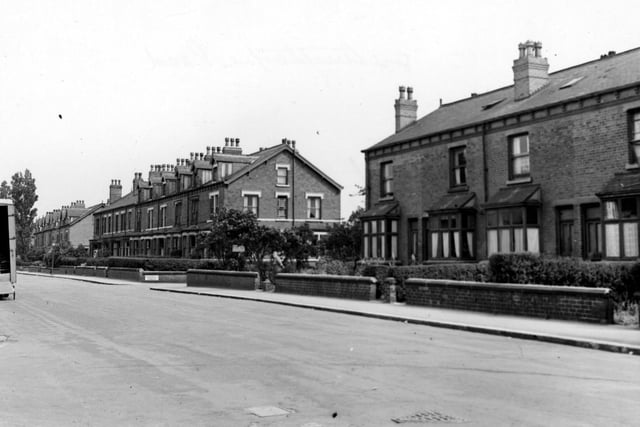Three blocks of brick terraced houses on Austhorpe Road in July 1948. None of the gate openings have their original iron gates due to the wartime appeal for metal.