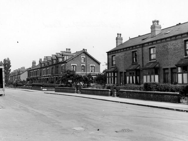 Three blocks of brick terraced houses on Austhorpe Road in July 1948. None of the gate openings have their original iron gates due to the wartime appeal for metal.