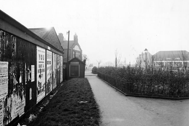 A footpath near Cross Gates Ring Road in January 1946. To the left is a wall covered with posters for the forthcoming muncipal elections.