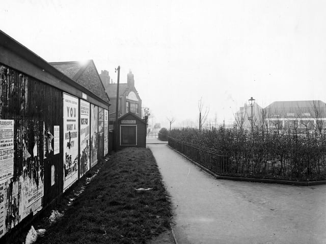 A footpath near Cross Gates Ring Road in January 1946. To the left is a wall covered with posters for the forthcoming muncipal elections.