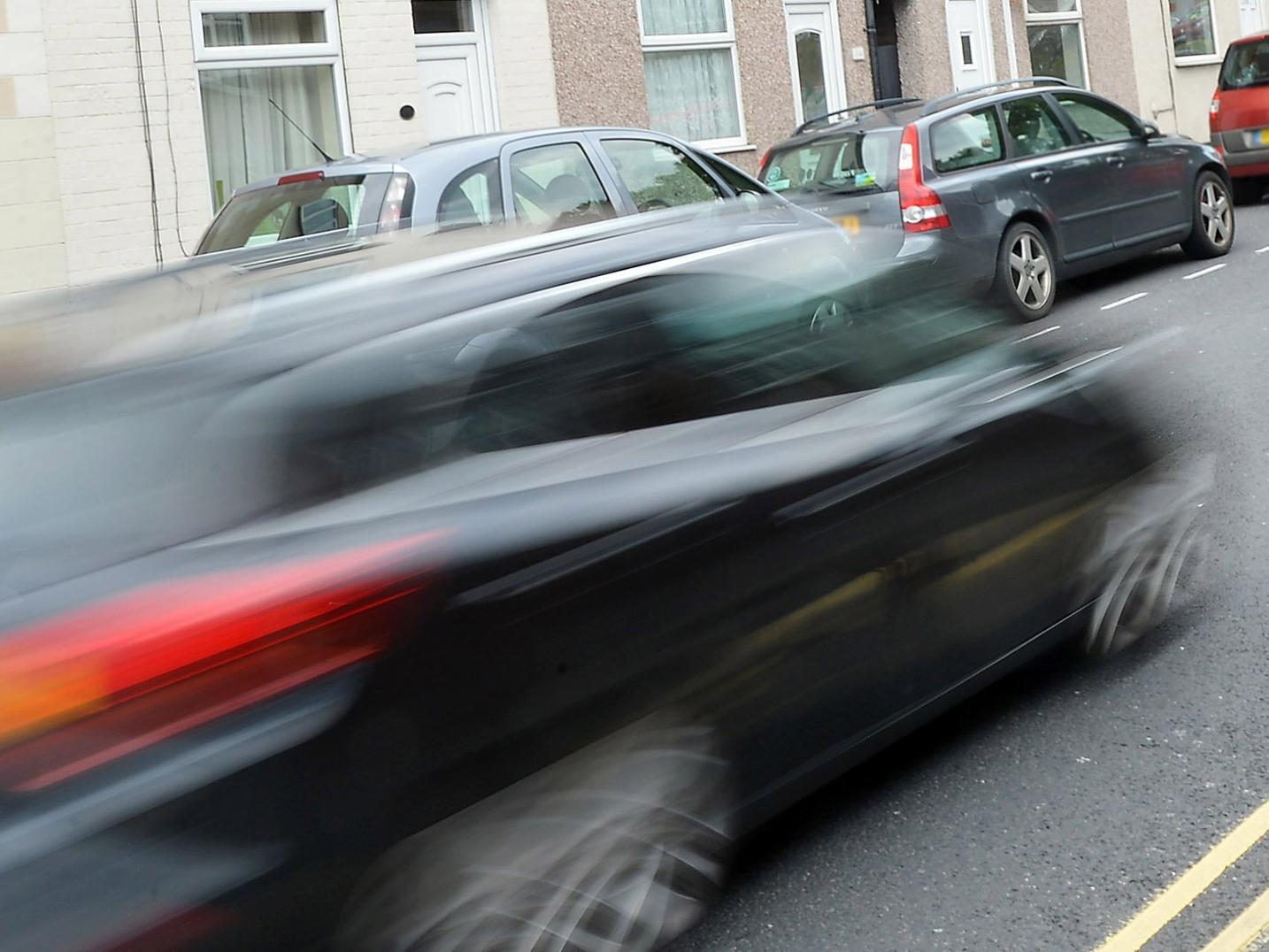 A speeding car.