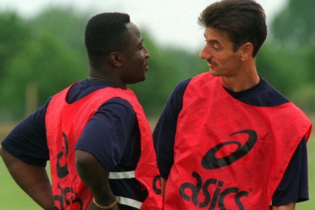 Tony Yeboah and Ian Rush chat during the first training session of the new season in July 1996.