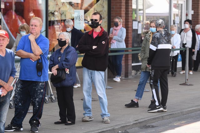 Most customers waiting in line for M&S already had their masks on ready to enter the store.