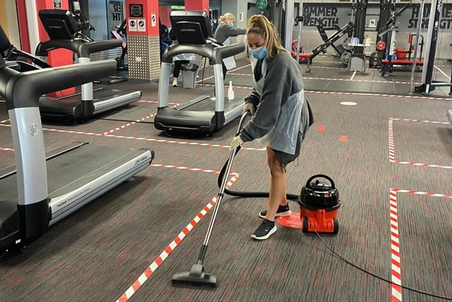 Saskia Ramsey, centre operative at St Anne's YMCA, cleans the gym regularly between members under strict hygiene rules.