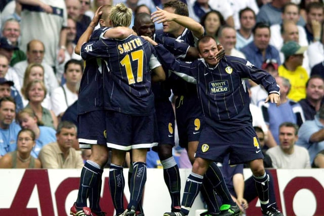 Alan Smith and teammates celebrate his startling fifth-minute opener, an angled grass-cutter from 25 yards. But it was not enough to secure the points at White Hart Lane.