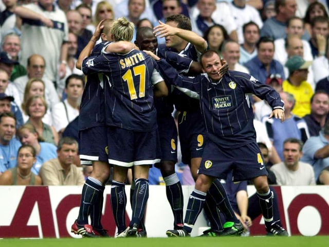 Alan Smith and teammates celebrate his startling fifth-minute opener, an angled grass-cutter from 25 yards. But it was not enough to secure the points at White Hart Lane.