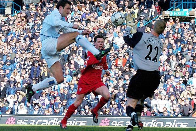 An Eirik Bakke snapshot and a Mark Viduka lob earned Leeds a point against Liverpool in a game which saw Harry Kewell score against his former team.