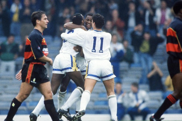 Chris Whyte is mobbed by teammates Chris Fairclough and Gary Speed after scoring against QPR at Elland Road. The Whites were edged out in a five goal thriller.