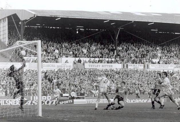 Les Sealey tips away a header from Lee Chapman during the League Cup semi final second leg at Elland Road.