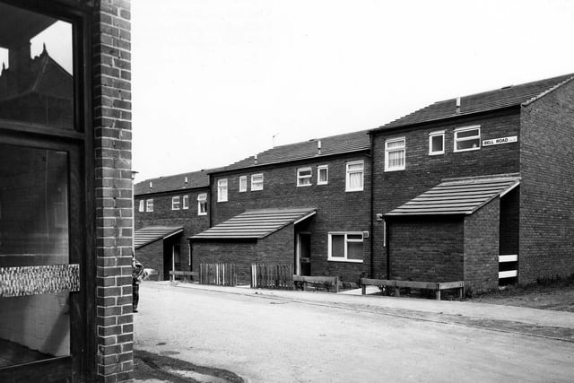 Bell Road seen from Upper Town Street, showing a row of houses with lean-to sheds in May 1979.