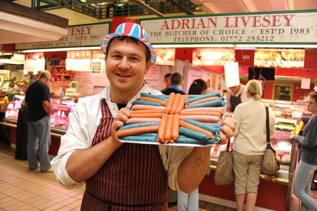 Butcher Sam Livesey with his Royal sausages in red, white and blue at Preston Market 2013