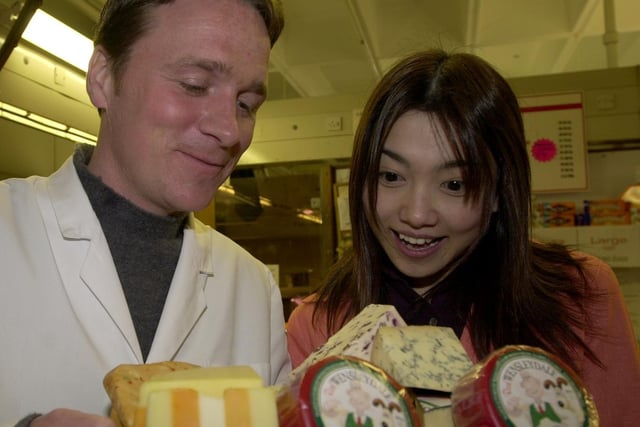 Jonathan Pickles from Pickles Cheese Stall, Preston Market, shows Kumiko Endo from TV Tokyo some of the many cheeses 2001.JPG