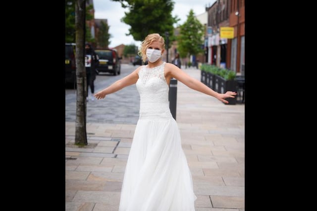 Last but not least, looking a million dollars is bride Emma Brice. Who cares about the mask?