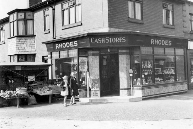 Rhodes, grocery store on corner of Vesper Road in September 1937. A stall selling fresh produce has been set up on the pavement. The City Engineer has marked photo with red cross implying permission has not been granted.