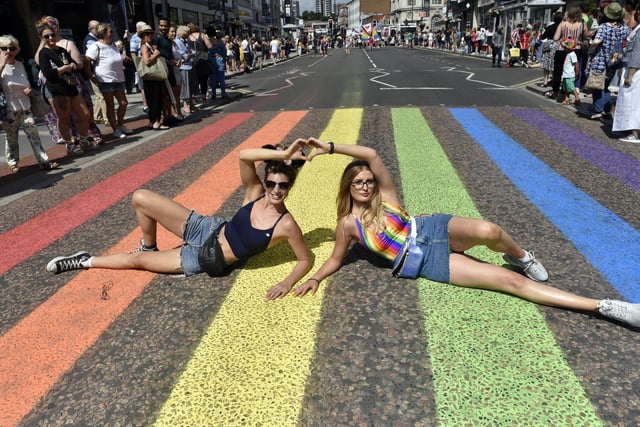 Two women on the rainbow on The Headrow.