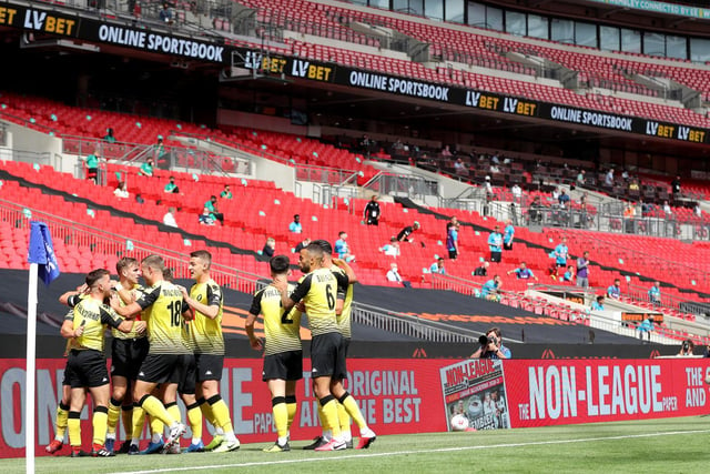 The Harrogate players celebrate the opening goal from George Thomson at Wembley.