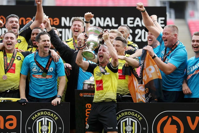 Players and staff celebrate their historic Wembley victory... a win which sees them promoted to the Football League.