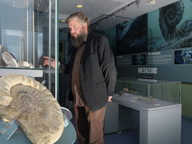 Collections manager Jim Middleton with a Bellarmine pot circa 1600