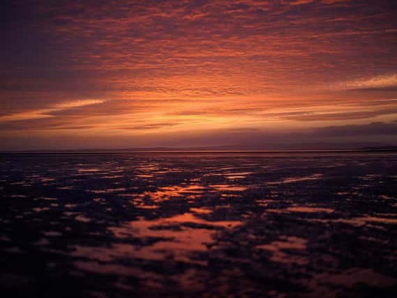 The sun sets over Morecambe Bay (Photo by Christopher Furlong/Getty Images)