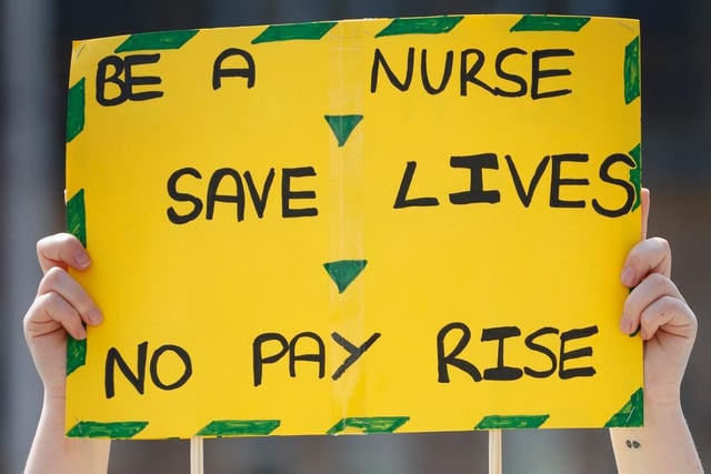 Placards took aim at Boris Johnson's "Stay Alert" slogan by saying "Be a nurse, save lives, no pay rise."