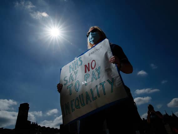 Workers took to Millennium Square today to protest nurses not being included in the pay rise.