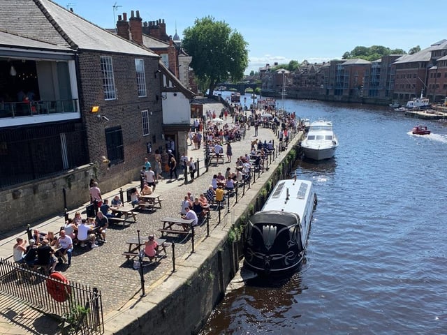 Making the most of the summer, people headed down to have a drink in the beer gardens by the River Ouse.
