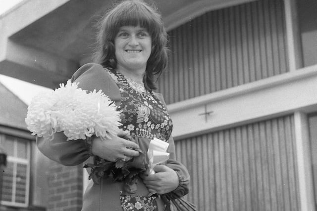 About to pay homage to a man she believes has been wronged by history, Brenda Claire Hollingsworth approaches a Blackpool church, cradling six white chrysanthemums in her arms. Brenda's floral tribute signifies her devotion to King Richard III on the 488th anniversary of his death at the Battle of Bosworth Field (August 22, 1485)