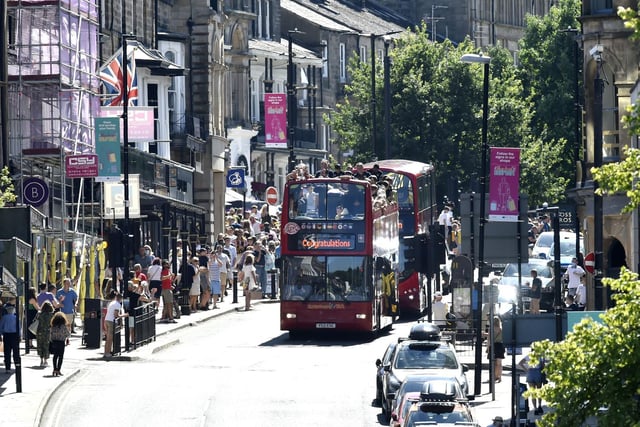 The open-top bus went around the streets of Harrogate showing off Town's trophy.